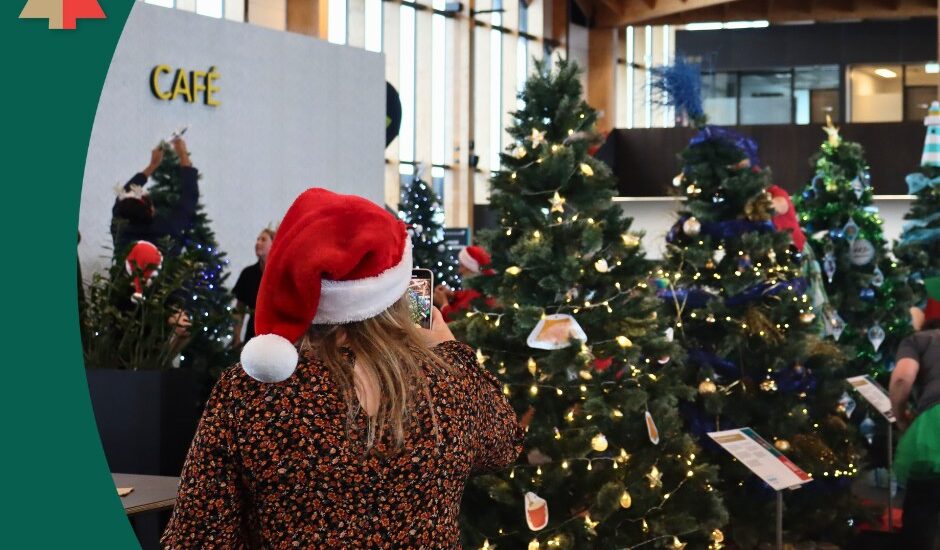 Jackie from Kaiteriteri Recreation Reserve decorates their sponsored tree at the Nelson Airport Trees of Remembrance 2025
