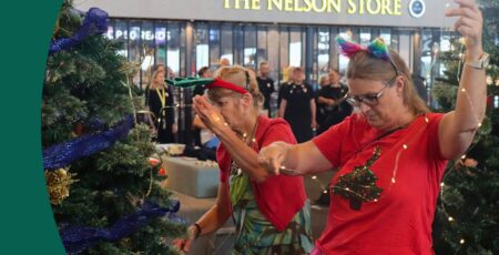 Nelson Pine Industries Ltd decorate their sponsored tree at the Nelson Airport Trees of Remembrance 2025